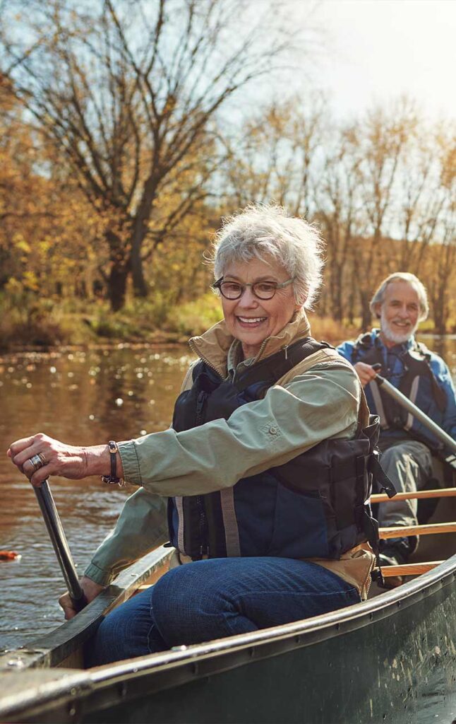 senior couple kayaking successful retirement strategies